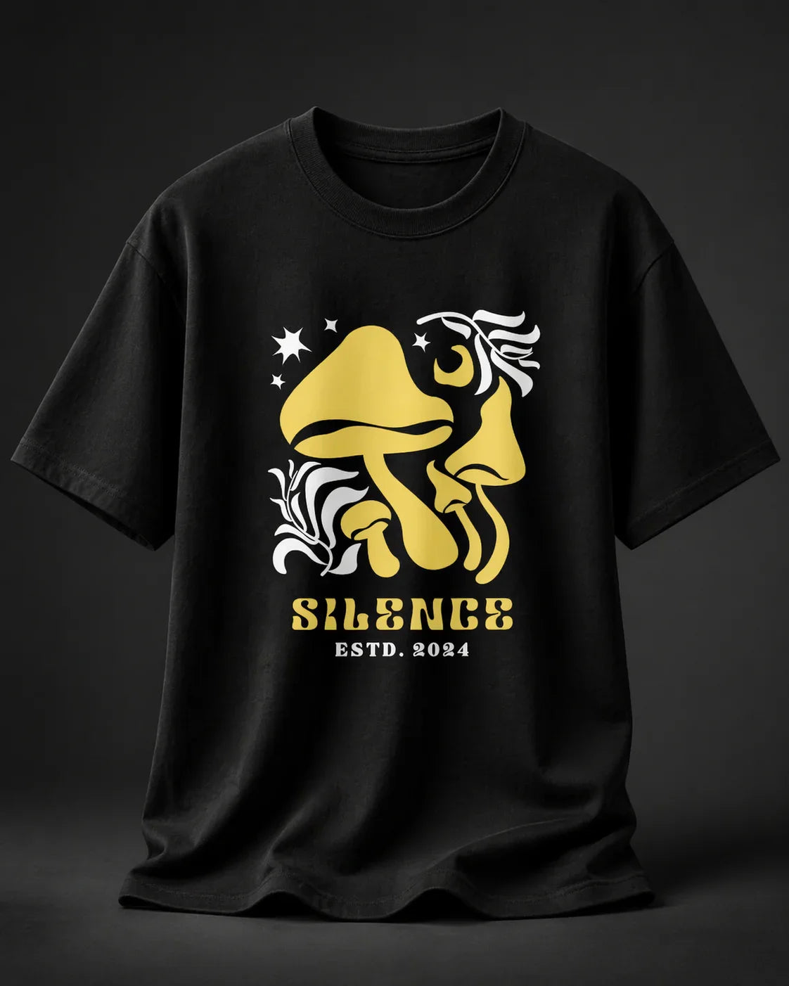 Black oversized t-shirt with yellow mushroom graphic, stars, and 'Silence ESTD. 2024' text
