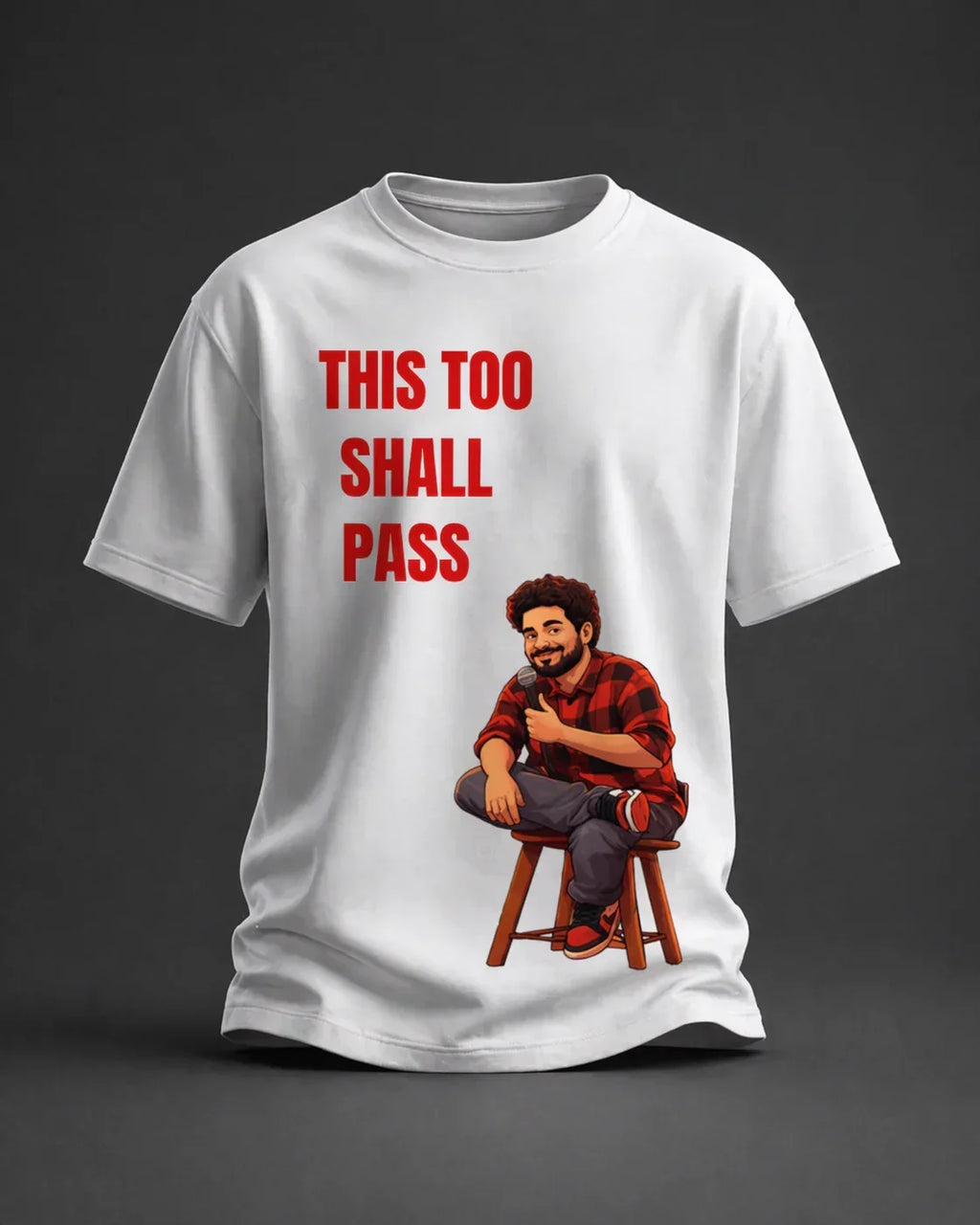 White oversized t-shirt with cartoon man holding a mic and 'This Too Shall Pass' text print