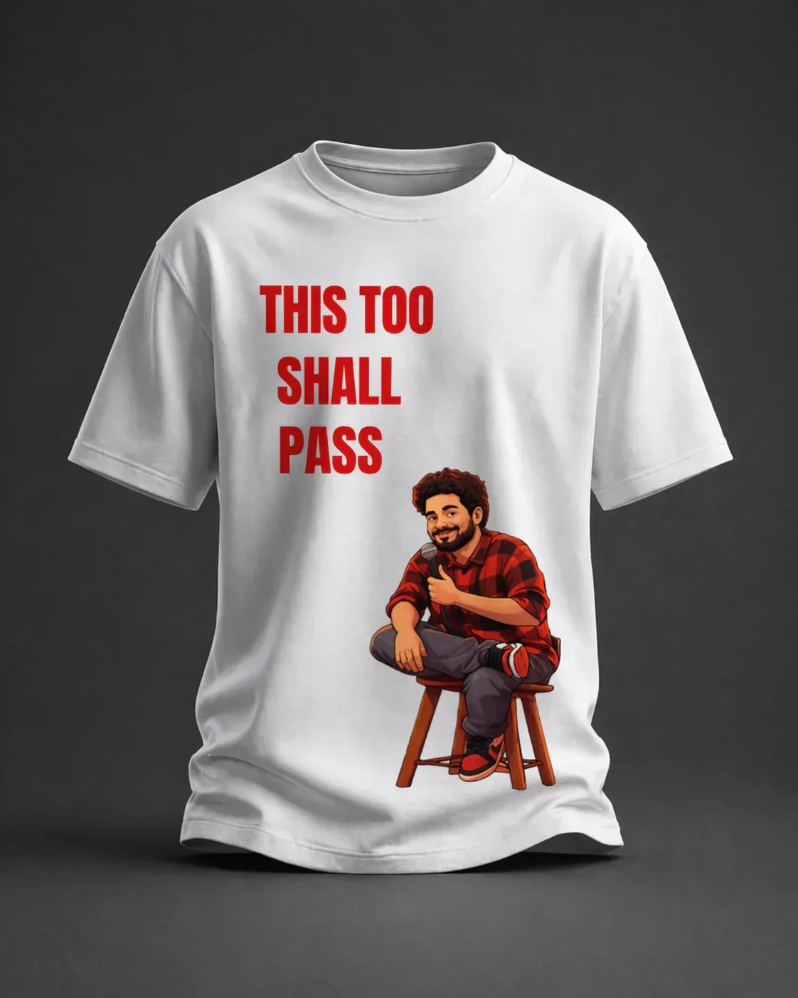 White oversized t-shirt with cartoon man holding a mic and 'This Too Shall Pass' text print