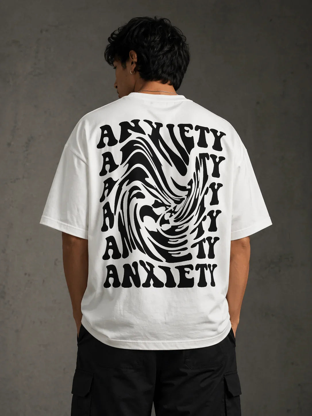 White oversized t-shirt with bold 'ANXIETY' graphic print, stylish streetwear design