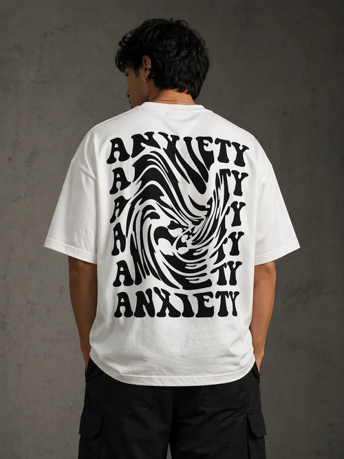 White oversized t-shirt with bold 'ANXIETY' graphic print, stylish streetwear design