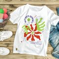 White oversized t-shirt with nature-inspired graphic, leaf illustrations, and 'Nature's Serenity' text